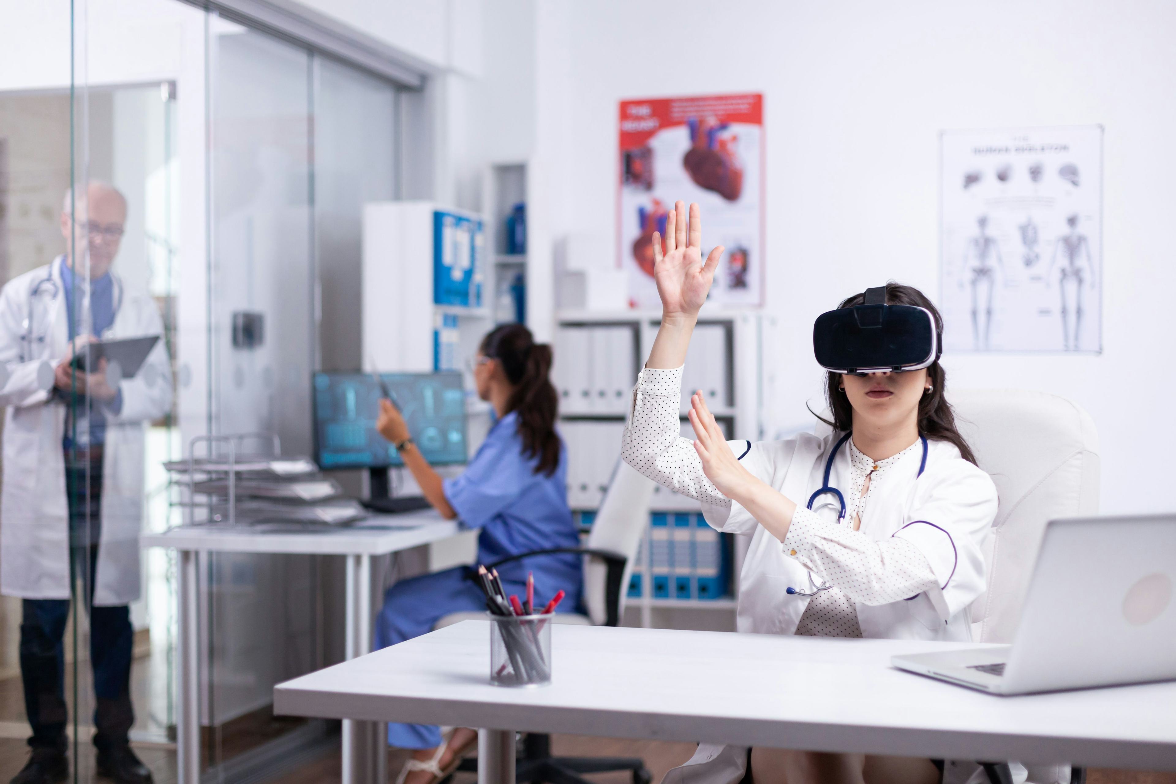 women with a vr set in a hospital office 