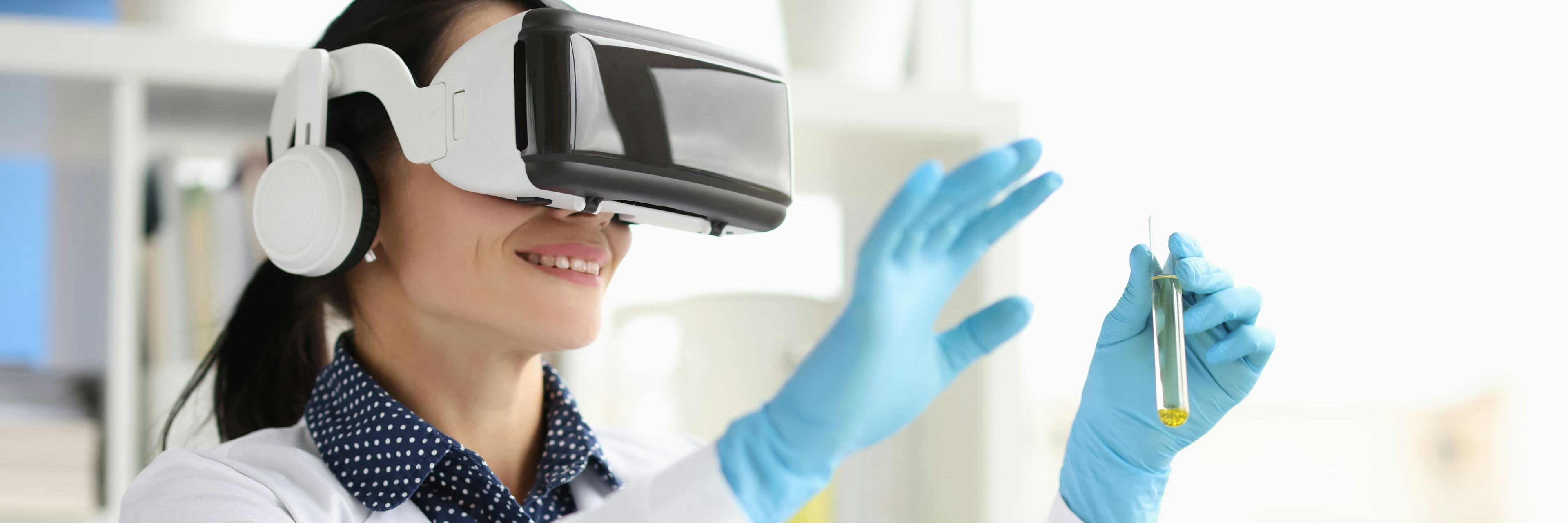 Young doctor wearing VR glasses and point finger up High quality photo
